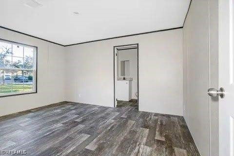 empty room featuring dark hardwood / wood-style floors