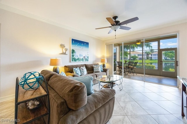 tiled living room with ornamental molding, a water view, and ceiling fan