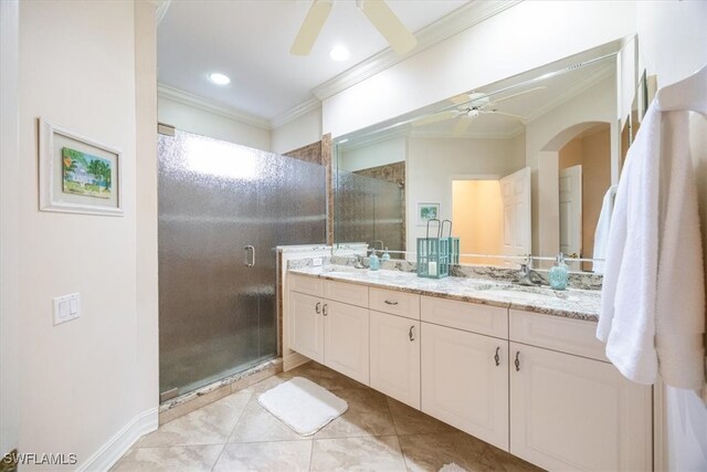 bathroom with vanity, walk in shower, crown molding, tile patterned flooring, and ceiling fan