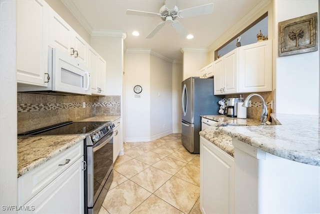 kitchen with backsplash, ceiling fan, appliances with stainless steel finishes, and white cabinetry