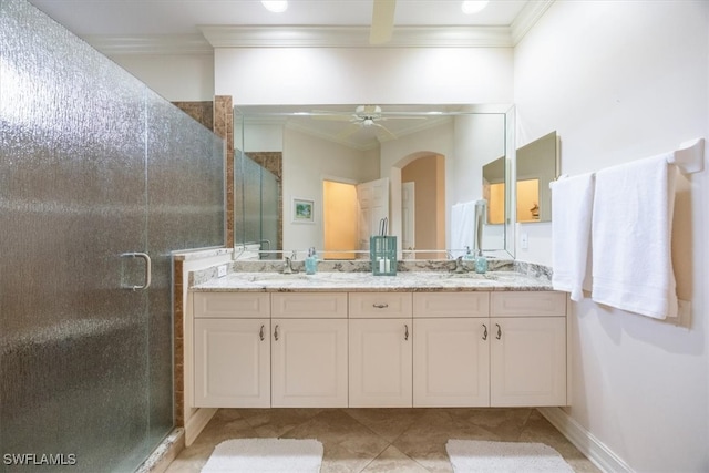 bathroom featuring walk in shower, ornamental molding, vanity, and ceiling fan