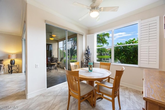 dining room with a healthy amount of sunlight, crown molding, and ceiling fan