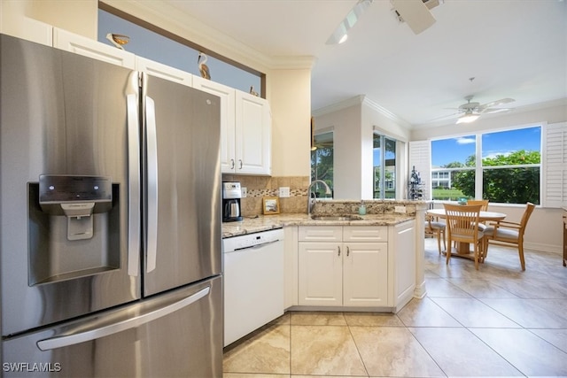 kitchen with stainless steel fridge, white cabinetry, tasteful backsplash, dishwasher, and ceiling fan