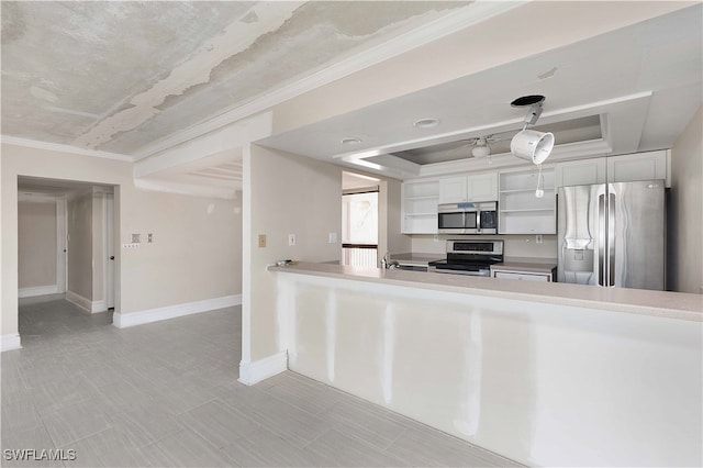 kitchen featuring ornamental molding, white cabinets, appliances with stainless steel finishes, and hanging light fixtures