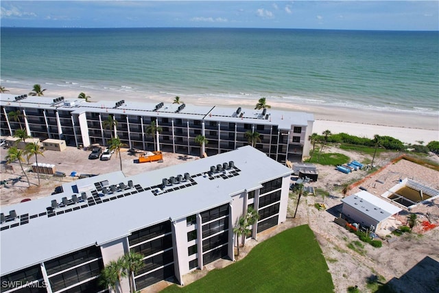 drone / aerial view featuring a view of the beach and a water view