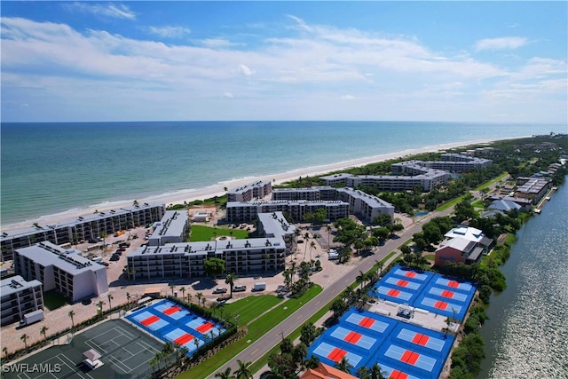 drone / aerial view featuring a view of the beach and a water view