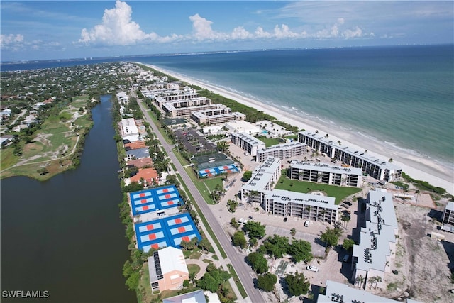 bird's eye view featuring a water view and a view of the beach