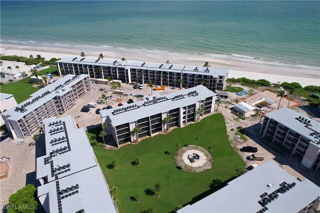 aerial view featuring a water view and a view of the beach