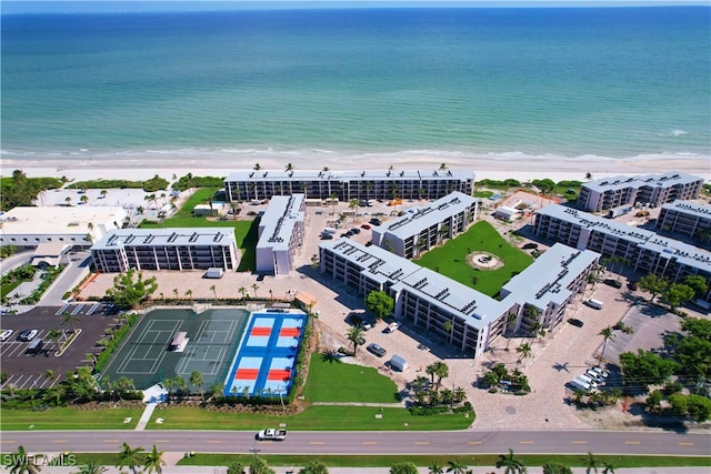 bird's eye view with a view of the beach and a water view