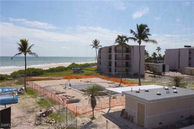 exterior space with a beach view and a water view