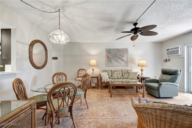 dining space featuring light tile patterned floors, a textured ceiling, ceiling fan with notable chandelier, and a wall mounted air conditioner