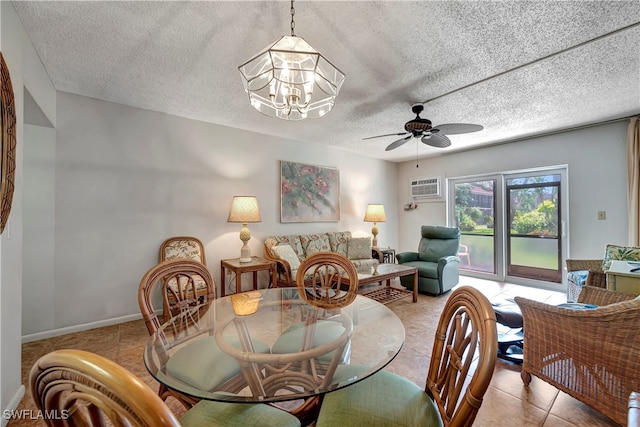 tiled dining room featuring ceiling fan with notable chandelier, a textured ceiling, and a wall mounted AC