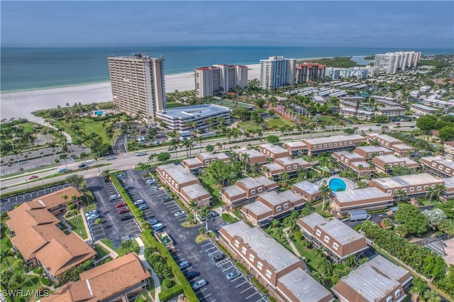 bird's eye view with a view of the beach and a water view