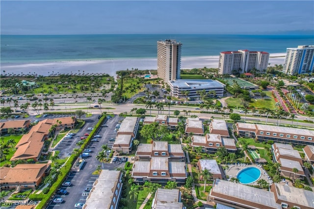 bird's eye view featuring a view of the beach and a water view