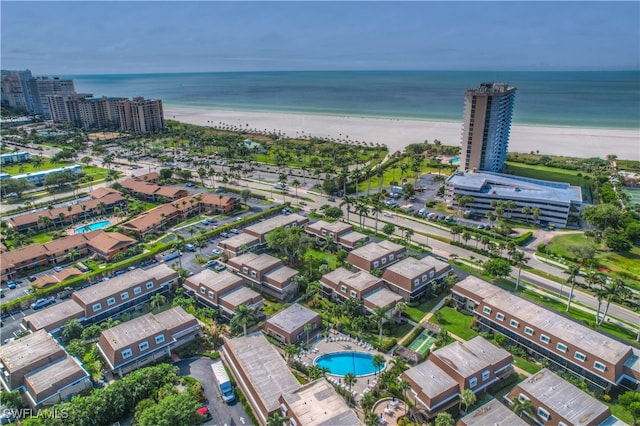 bird's eye view featuring a view of the beach and a water view