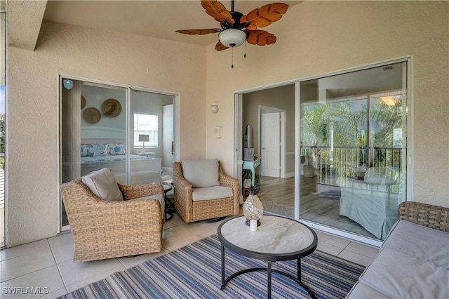 exterior space with ceiling fan