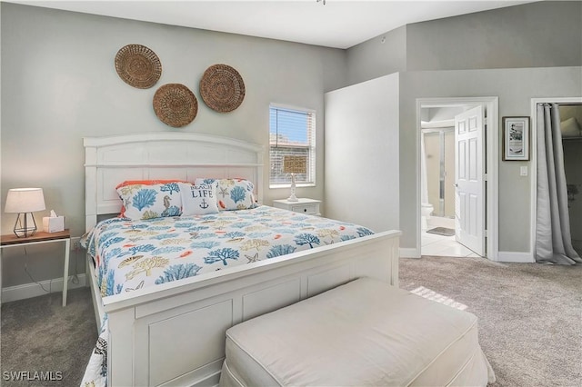 carpeted bedroom featuring ensuite bathroom