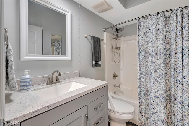 full bathroom featuring shower / bath combination with curtain, vanity, and toilet