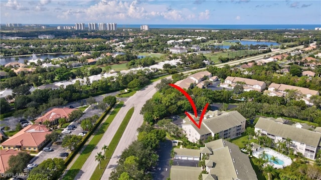 birds eye view of property featuring a water view