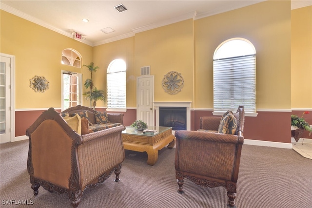 carpeted living room with crown molding