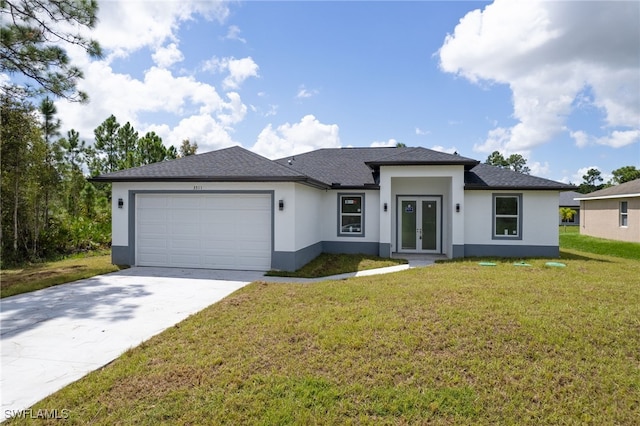 view of front of property featuring a garage, a front lawn, and french doors