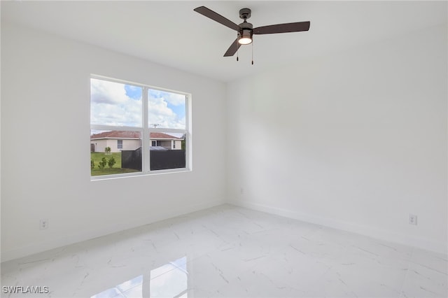 unfurnished room with ceiling fan