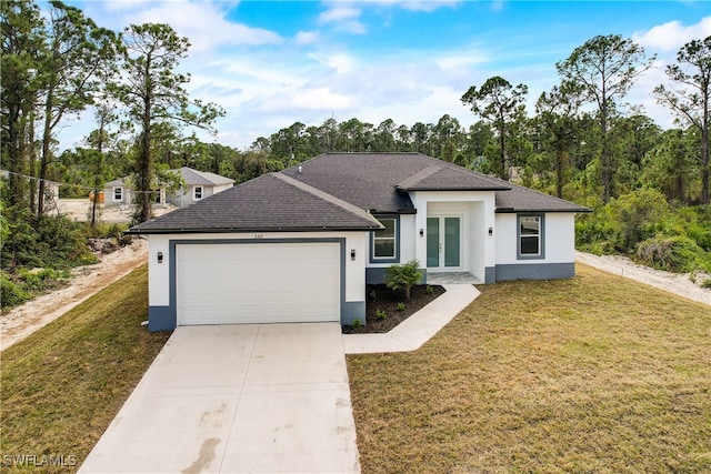 view of front of house featuring a front yard and a garage