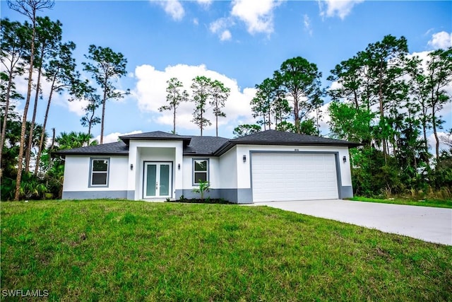 view of front of house with french doors, a front lawn, and a garage