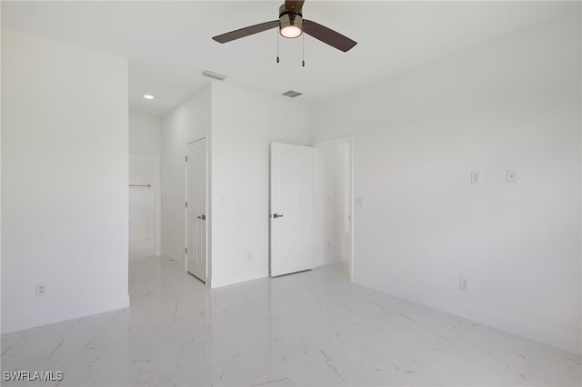 unfurnished bedroom featuring ceiling fan