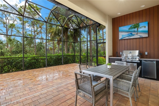 view of patio / terrace featuring grilling area and a lanai