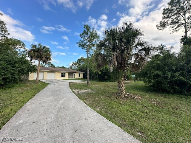 single story home with a front lawn and a garage