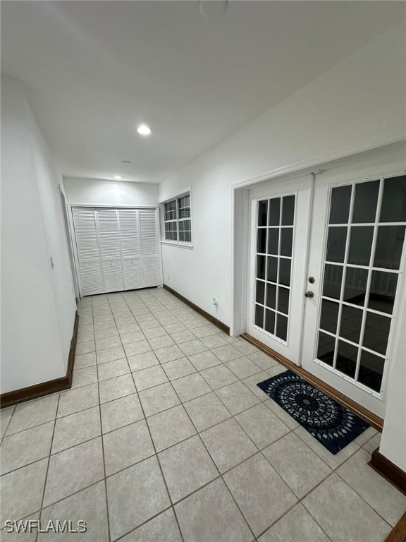 foyer entrance with light tile patterned floors