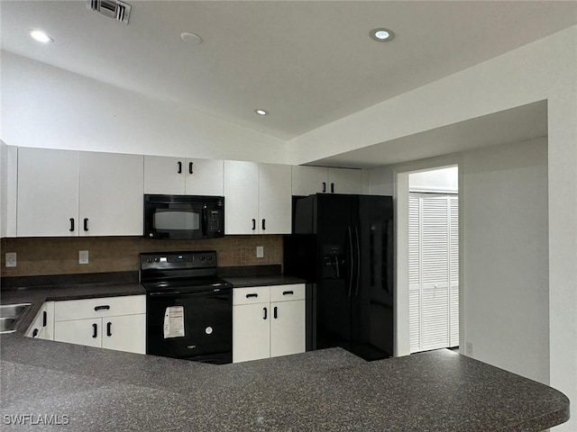 kitchen featuring white cabinets, backsplash, vaulted ceiling, and black appliances