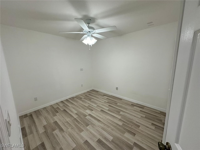 unfurnished room featuring light wood-type flooring and ceiling fan