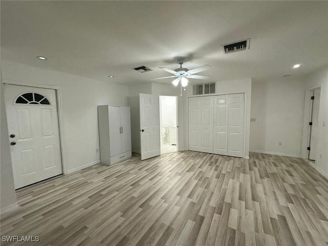 interior space featuring light wood-type flooring and ceiling fan