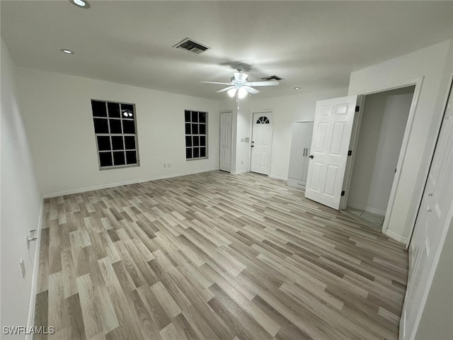 interior space with light hardwood / wood-style floors and ceiling fan