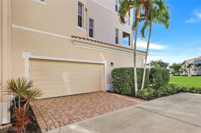 view of side of property with a garage