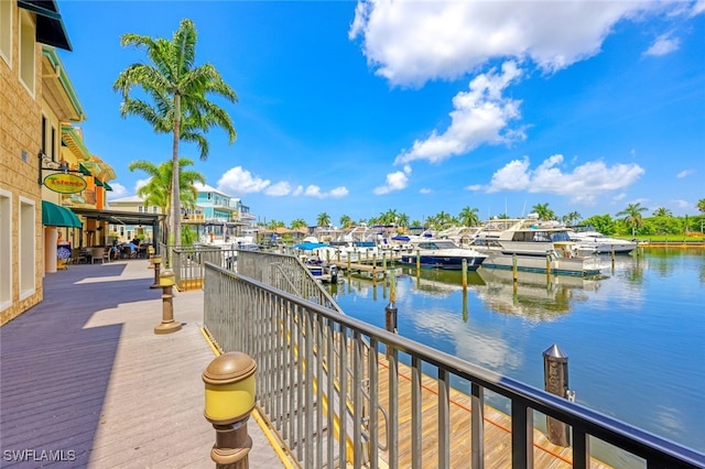 balcony featuring a dock and a water view