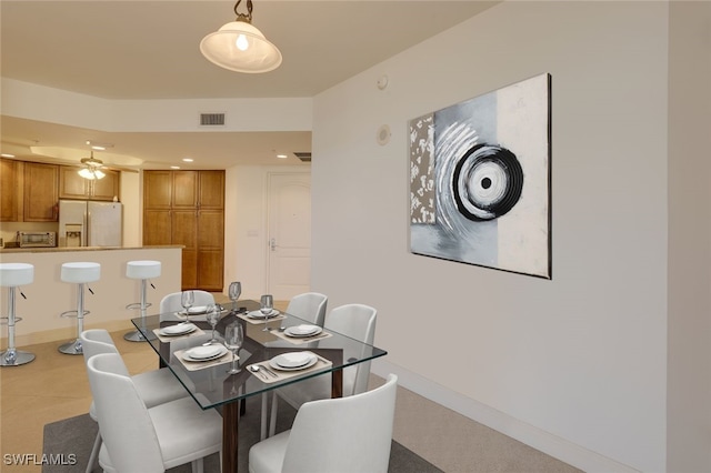 dining space with ceiling fan