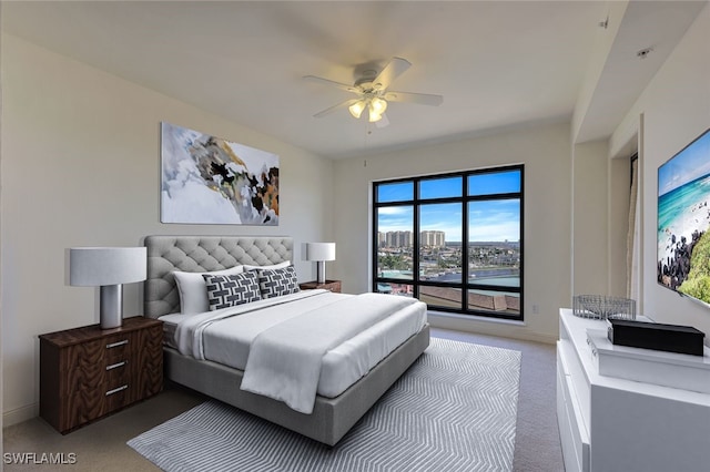 bedroom featuring access to exterior, ceiling fan, and light colored carpet