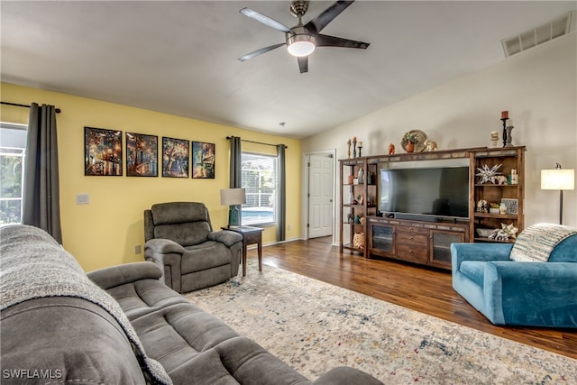 living room with vaulted ceiling, ceiling fan, and hardwood / wood-style floors