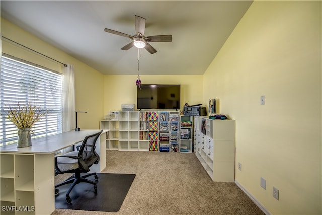 office space with lofted ceiling, ceiling fan, and carpet floors