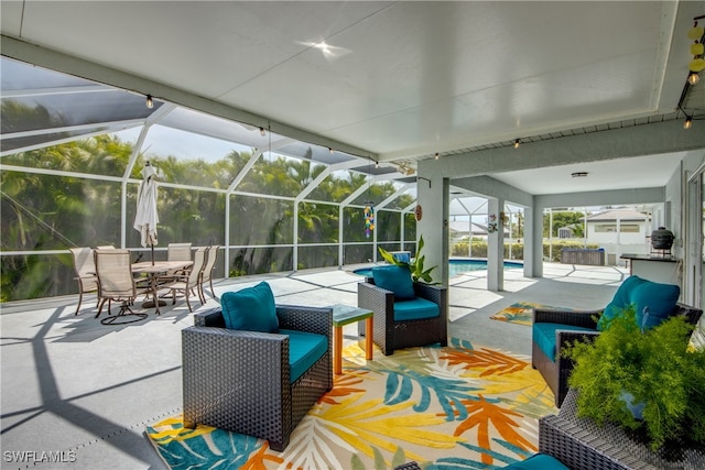 view of patio / terrace with an outdoor hangout area and glass enclosure