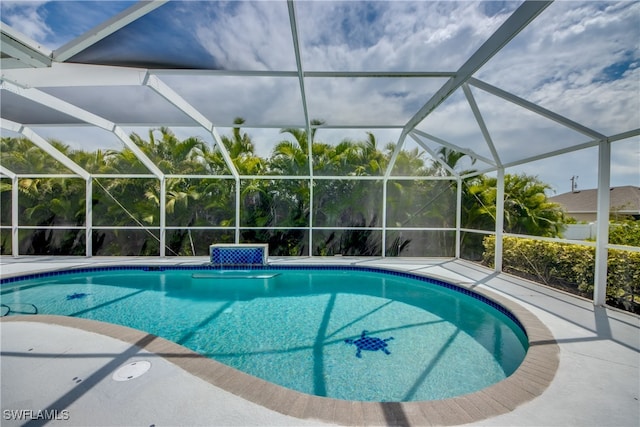 view of pool featuring a lanai and a patio