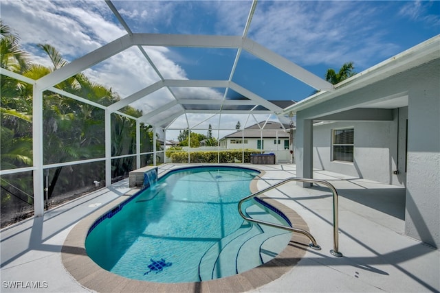 view of pool featuring a lanai and a patio area