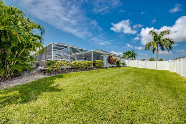 view of yard with a lanai