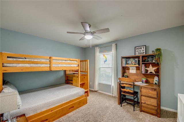 bedroom featuring ceiling fan and light carpet