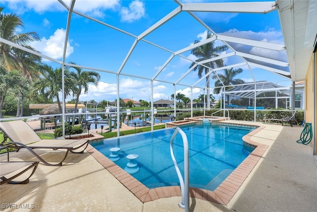 view of pool with a lanai, a patio, and a water view