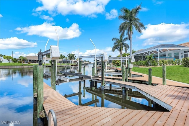 view of dock featuring a water view, a yard, and glass enclosure