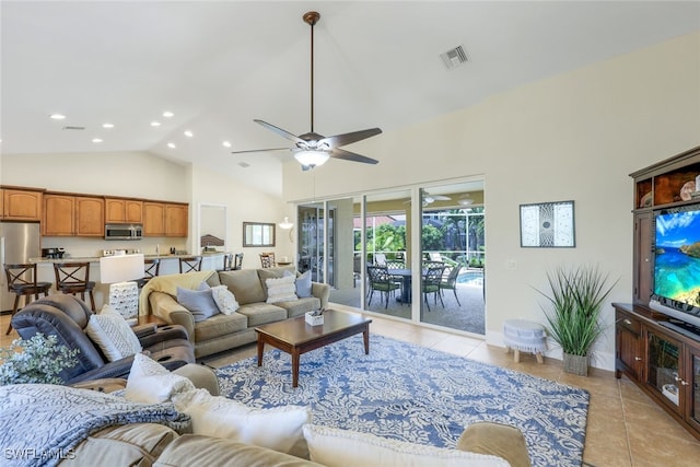 living room featuring light tile patterned floors, ceiling fan, and high vaulted ceiling